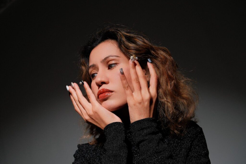 Model wearing Editory Atelier hand-painted press-on nails