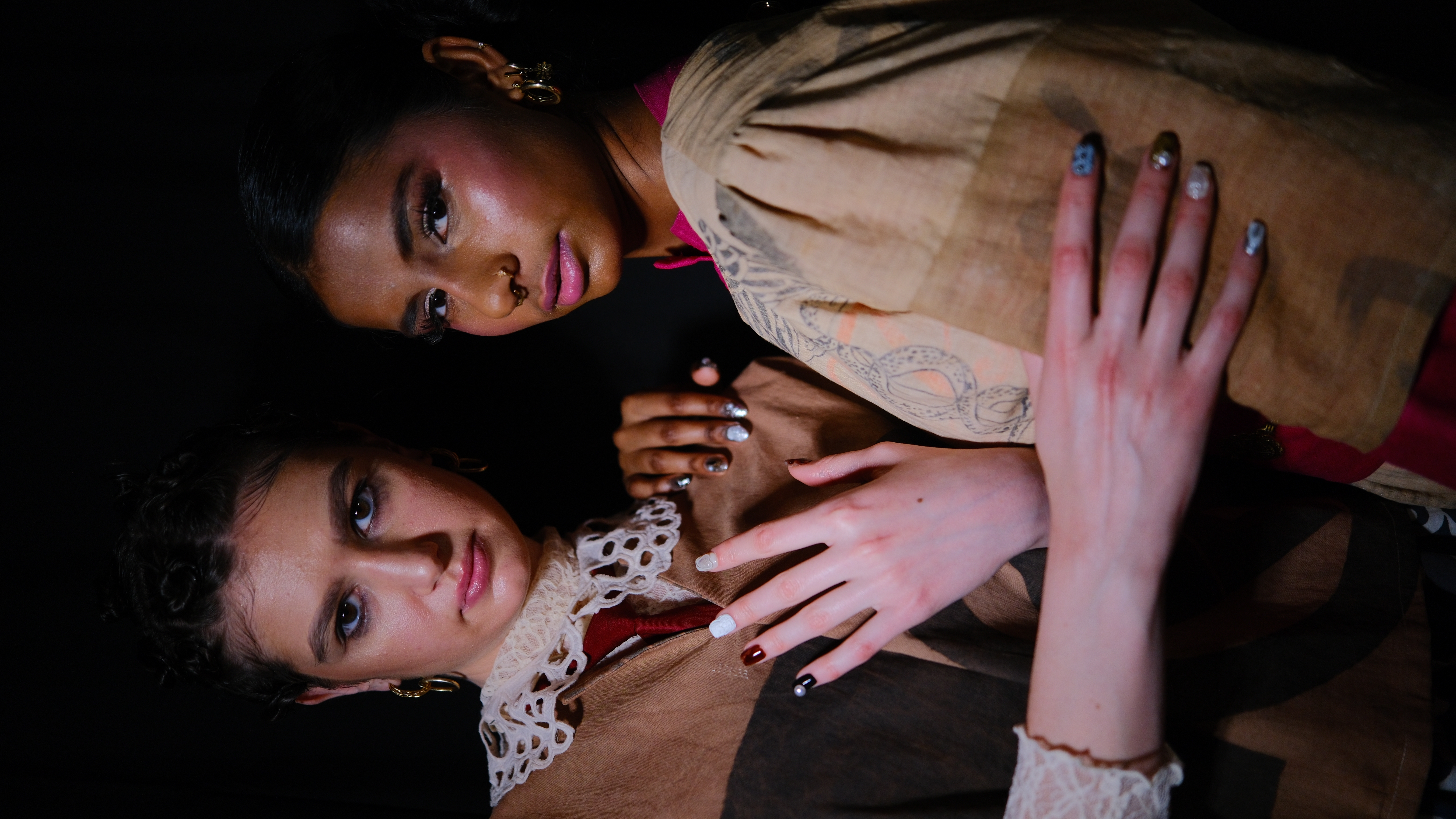 Models wearing Editory Atelier nail art at fashion event