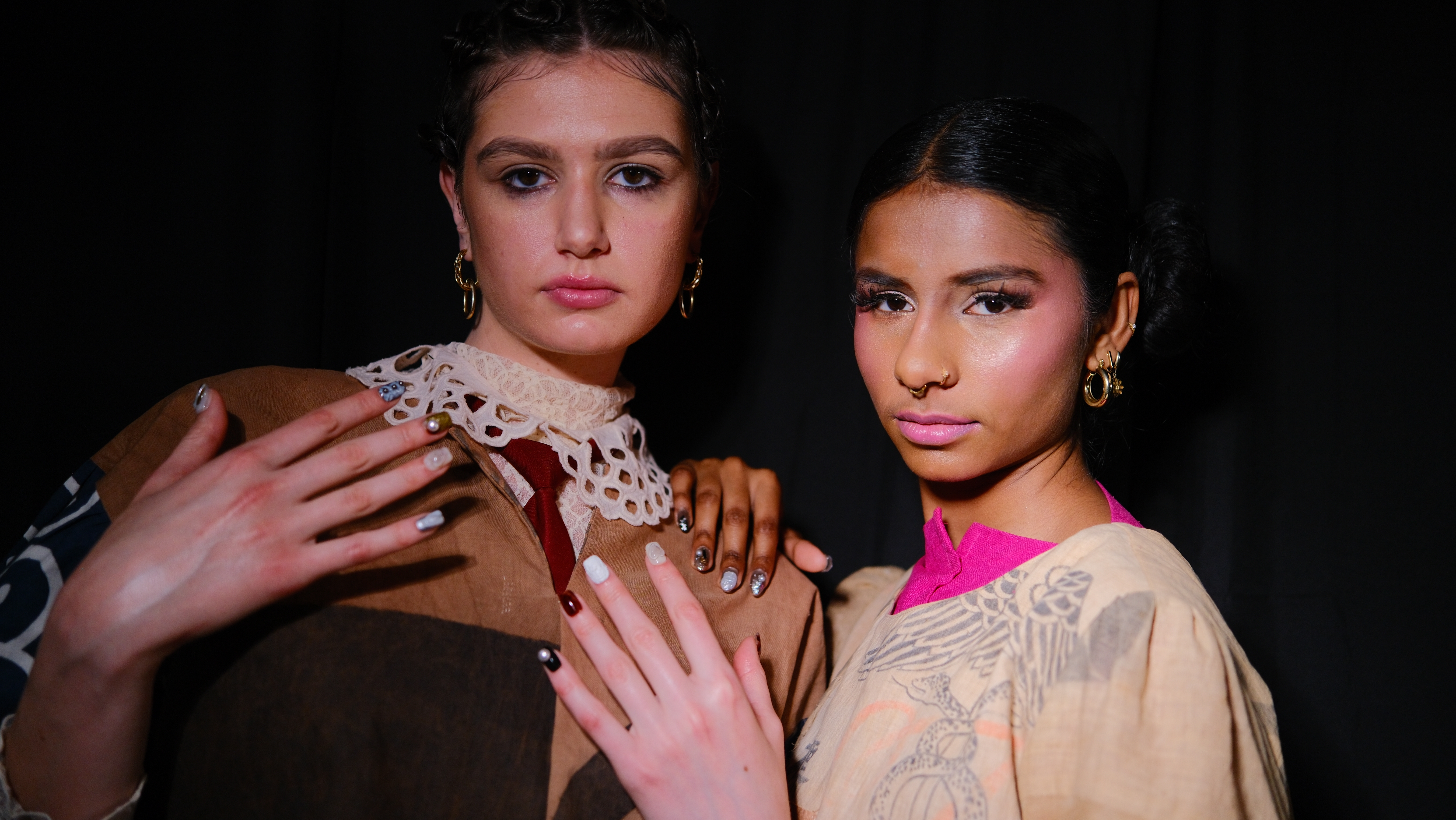Two models wearing Editory Atelier press-on nails backstage